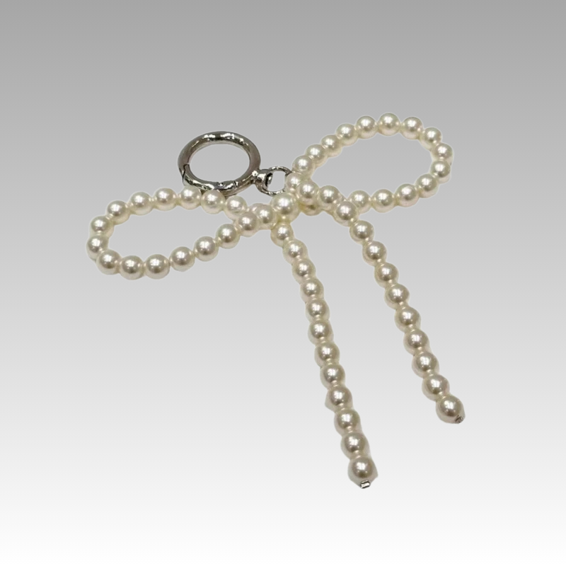 Belle Pearl Charm Perlen-Schleife an Tasche