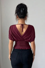 Celestine elegante V-Ausschnitt-Bluse kombiniert für einen festlichen Look