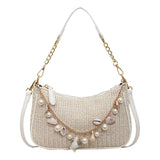 Norelya Geflochtene Strandtasche in Beige mit Muscheln, Perlen und goldener Kette – Frontansicht